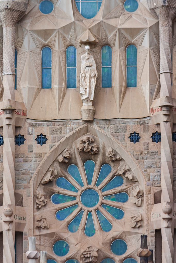 Close-up of Sagrada Familia's intricate stone facade in Barcelona, capturing its unique architecture.