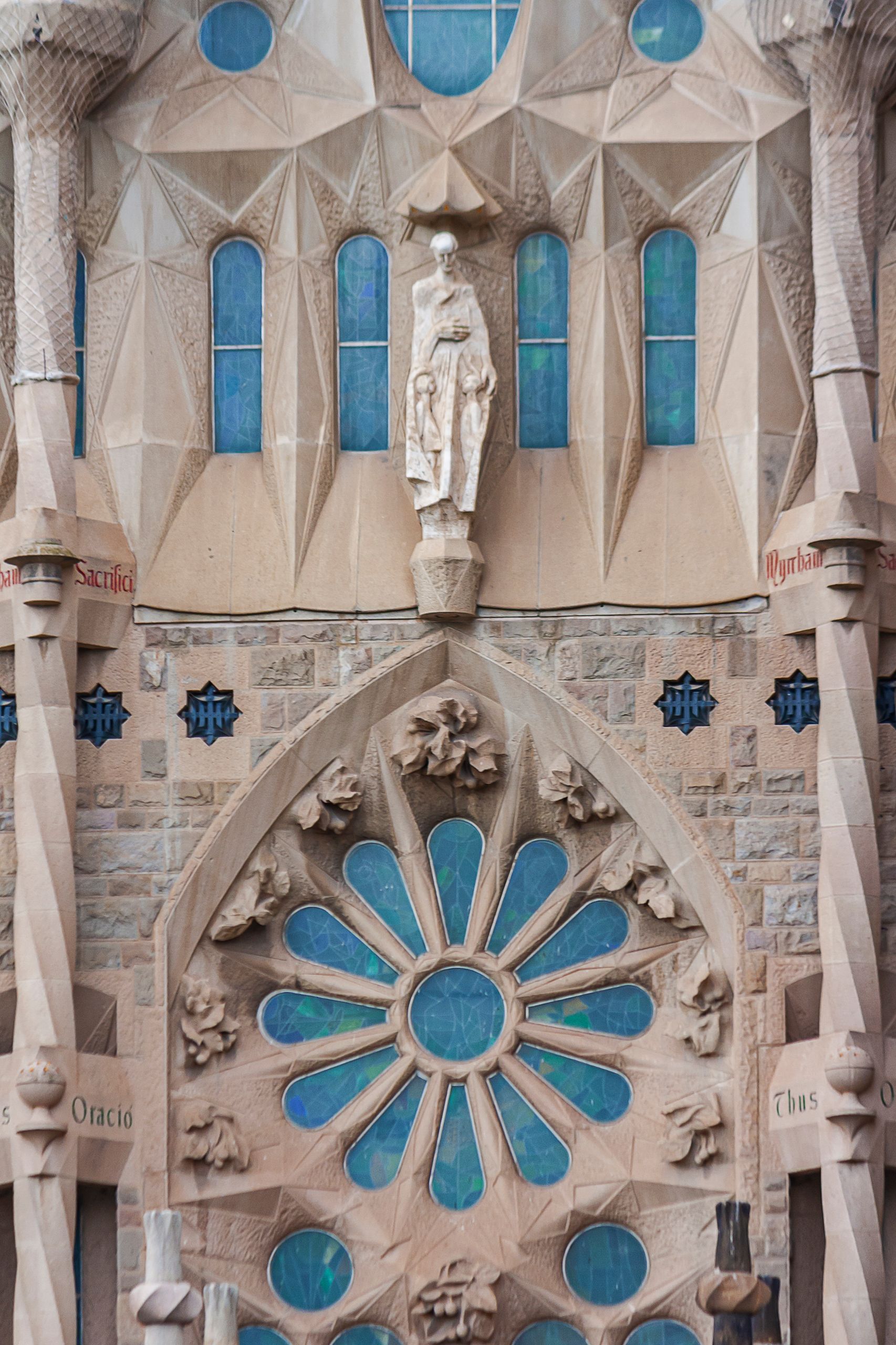 Close-up of Sagrada Familia's intricate stone facade in Barcelona, capturing its unique architecture.