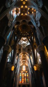 Marvel at the breathtaking ceiling of Sagrada Familia in Barcelona, showcasing Gaudi's architectural genius.